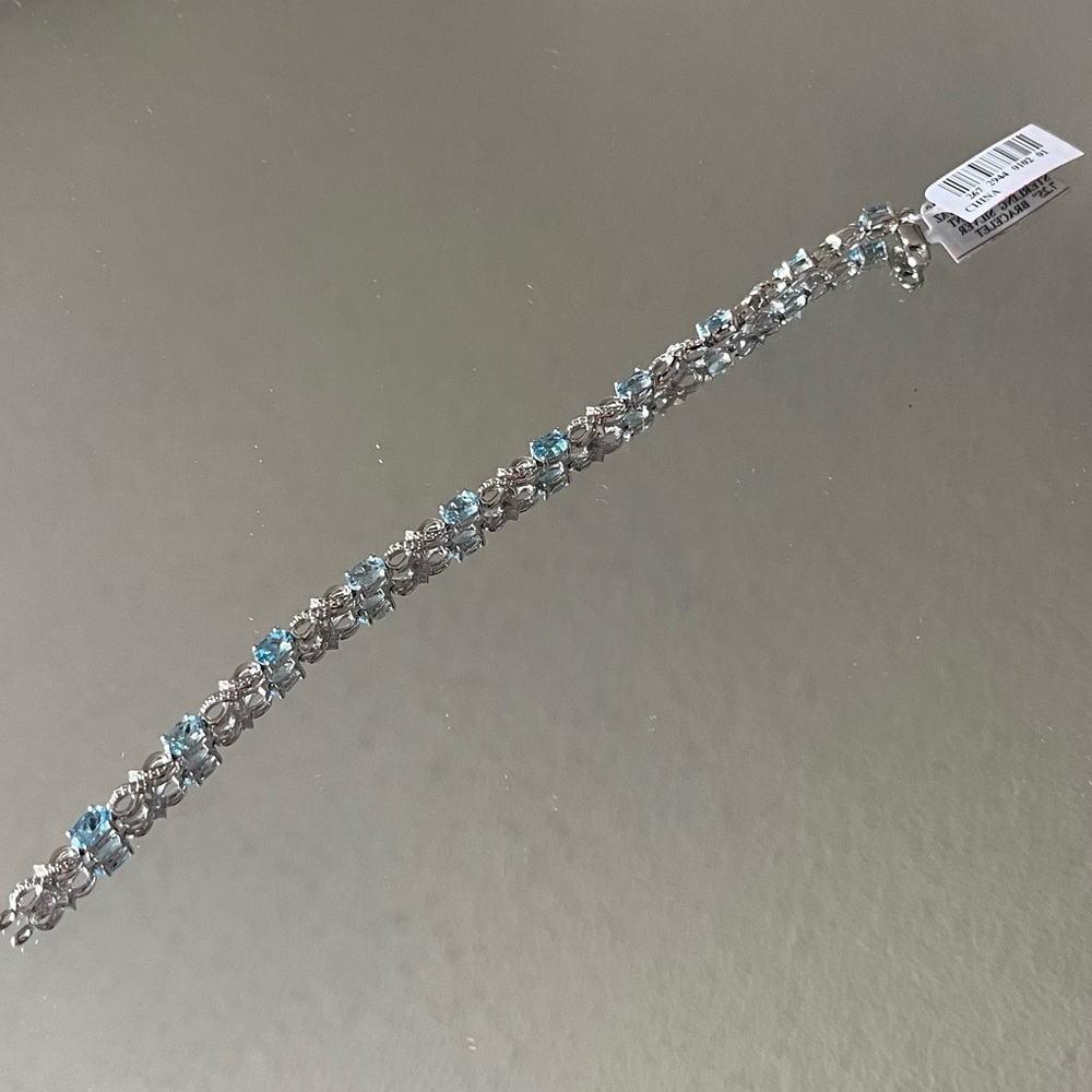 Never worn blue topaz bracelet with bow detail